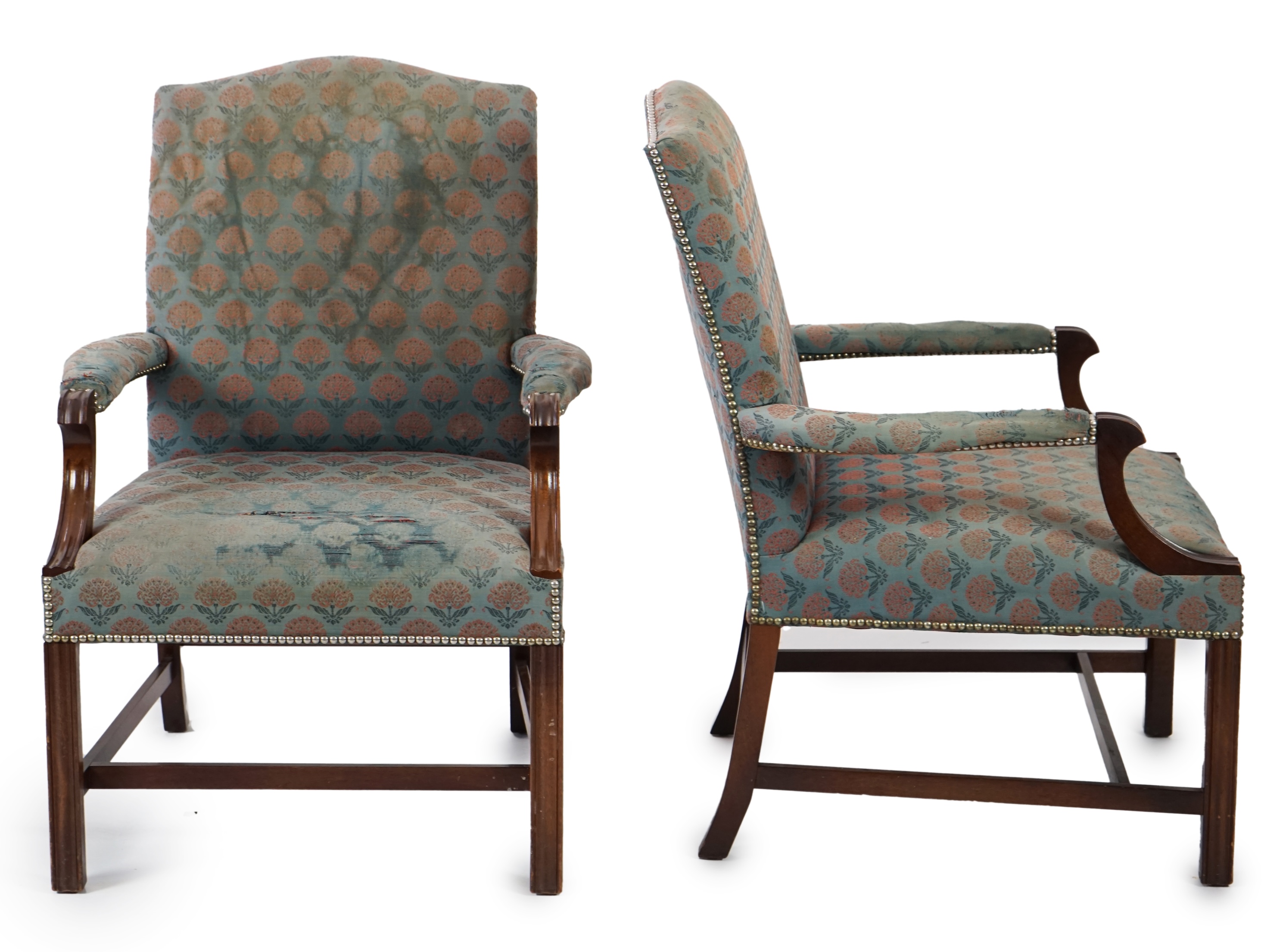 A pair of Thomas Glenister George III style mahogany Gainsborough armchairs